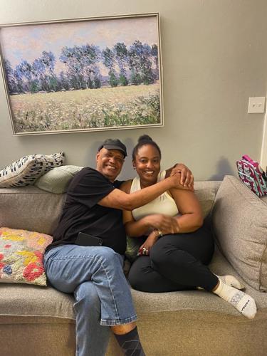 Lauren Rivers-Taylor sits with Sutton