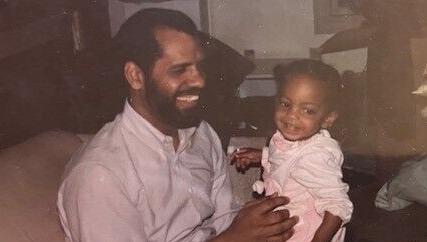 Lauren Rivers sits on Will Sutton's lap